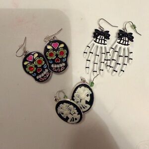 NWOT. Three pair of Halloween theme dangly earrings, skull, skeleton, ghost